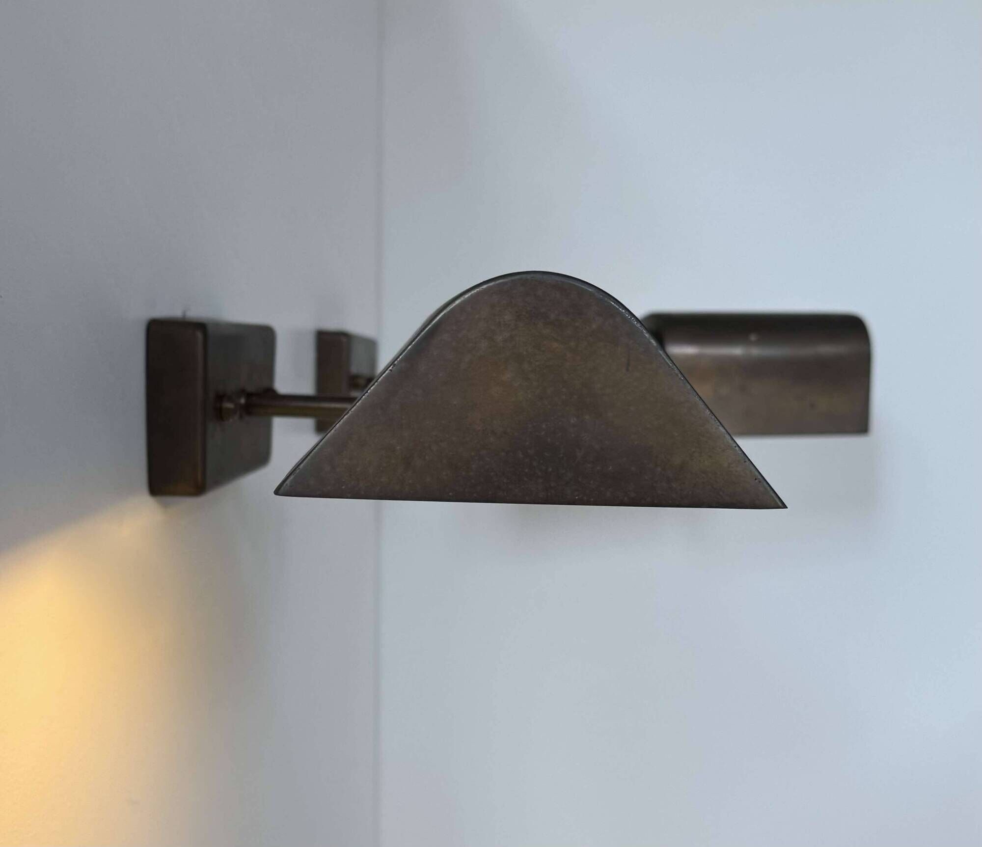 Pair of vintage adjustable wall lights, patinated brass, France 1970.