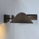 Pair of vintage adjustable wall lights, patinated brass, France 1970.
