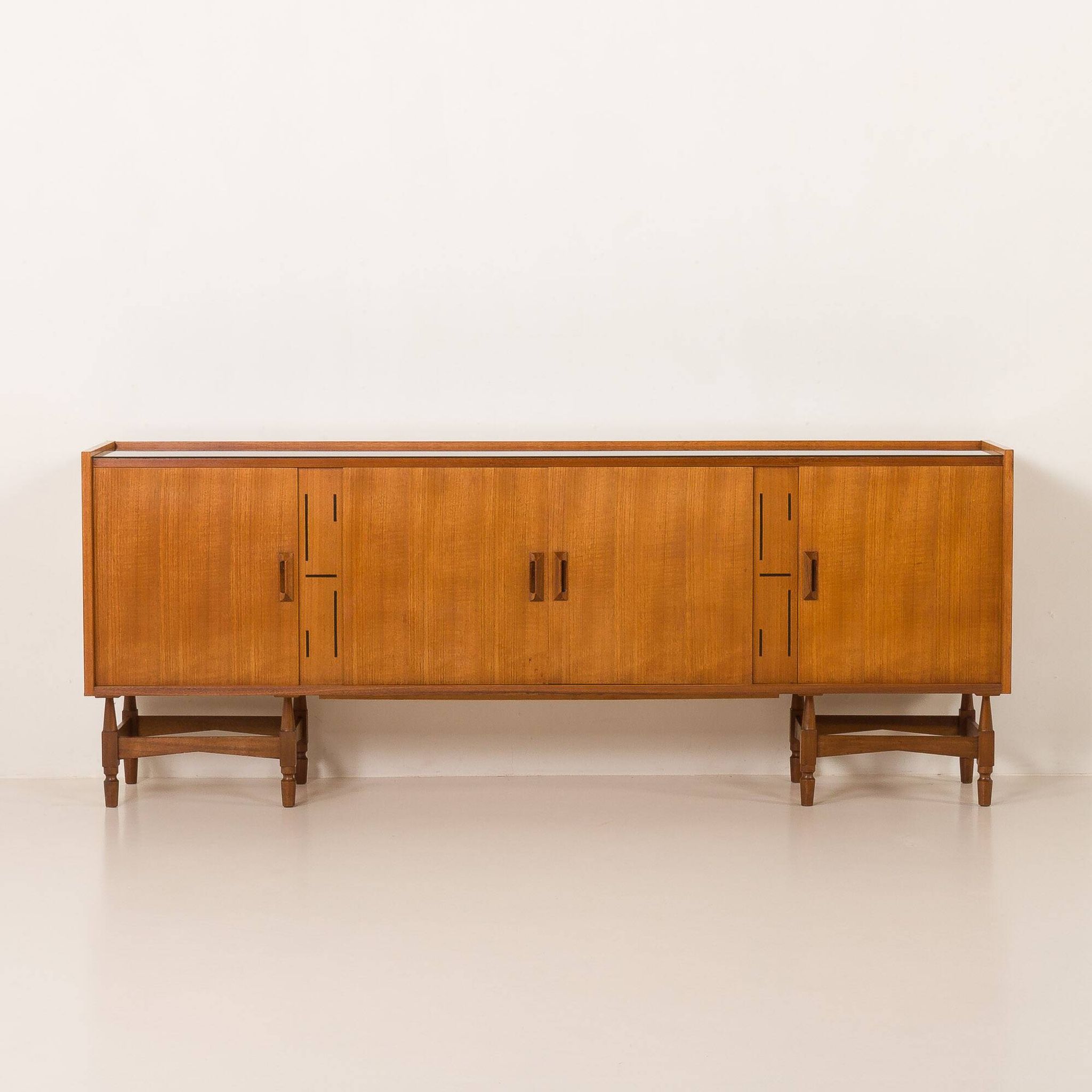 Itaian mid century teak sideboard with black glass top and inlays, 1970s