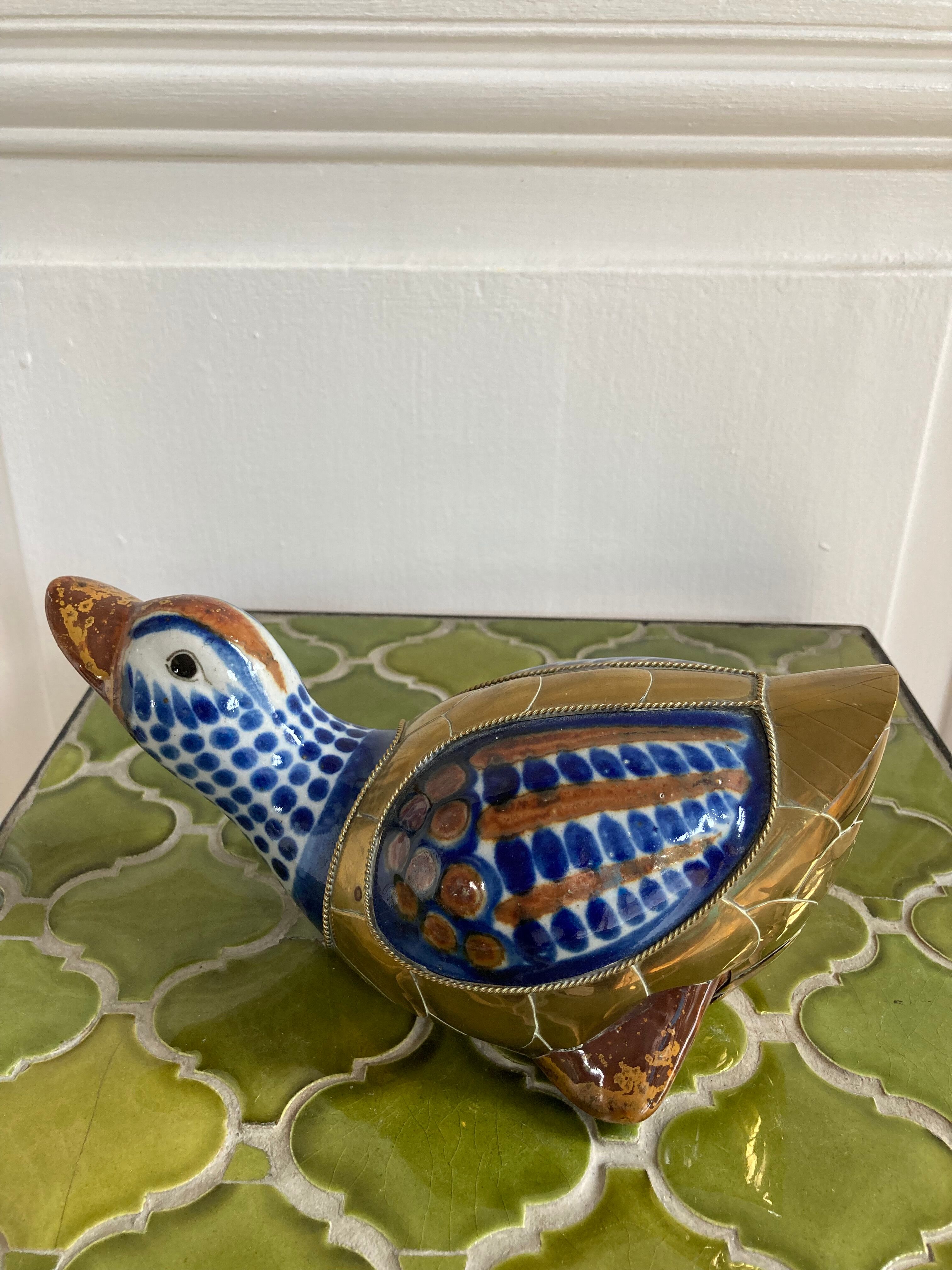 Brass duck and ceramic