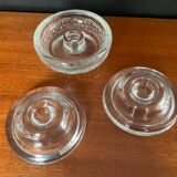 Set of three round thick moulded glass candle holders