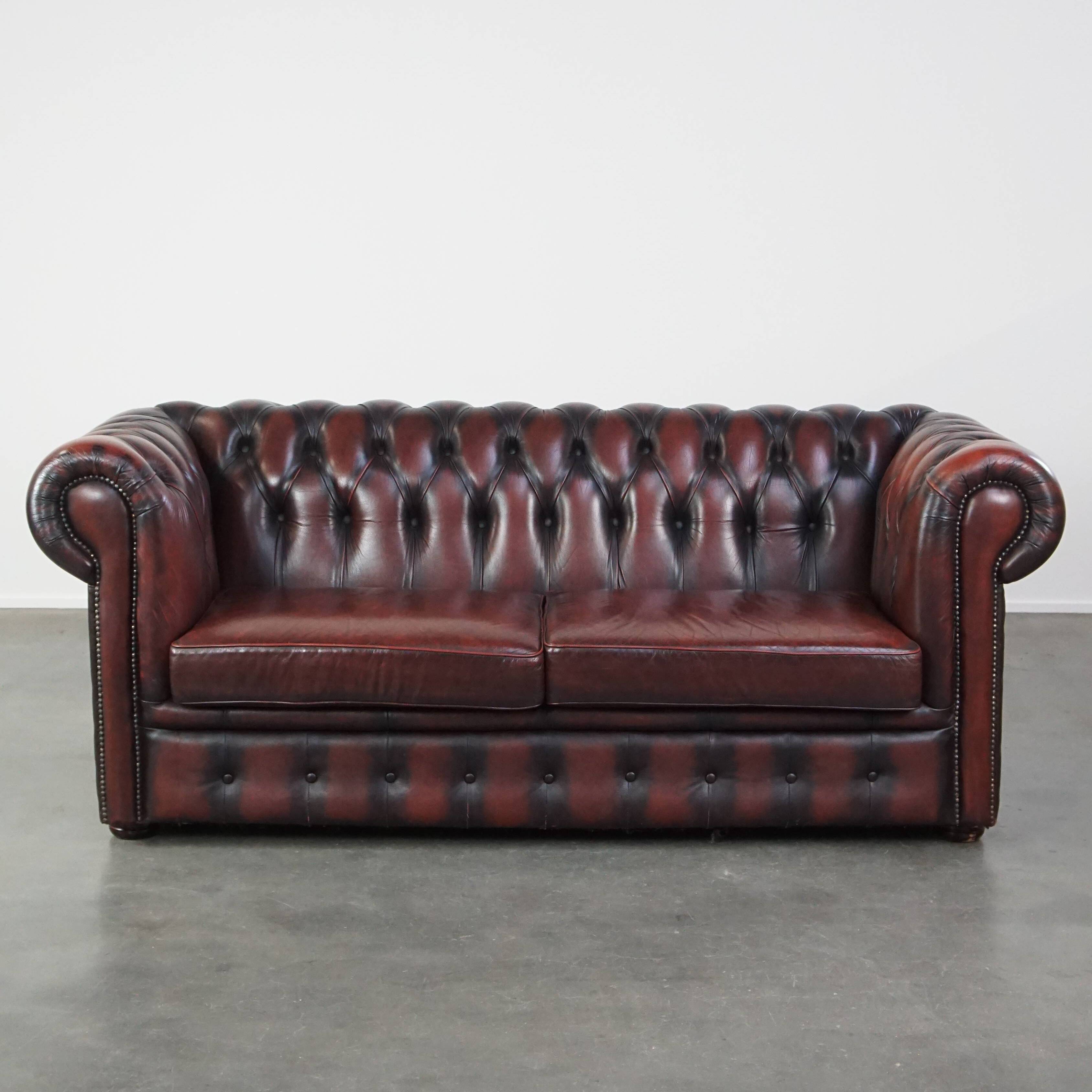 Chesterfield 2.5 seater sofa in dark red cowhide leather