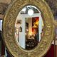 A. Arens, Antwerp, important oval mirror in repoussé brass with numerous animal decorations