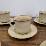 5 enameled stoneware cups and saucers