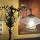 Bronze table lamp with dragon arm and cut glass shade, 1940s