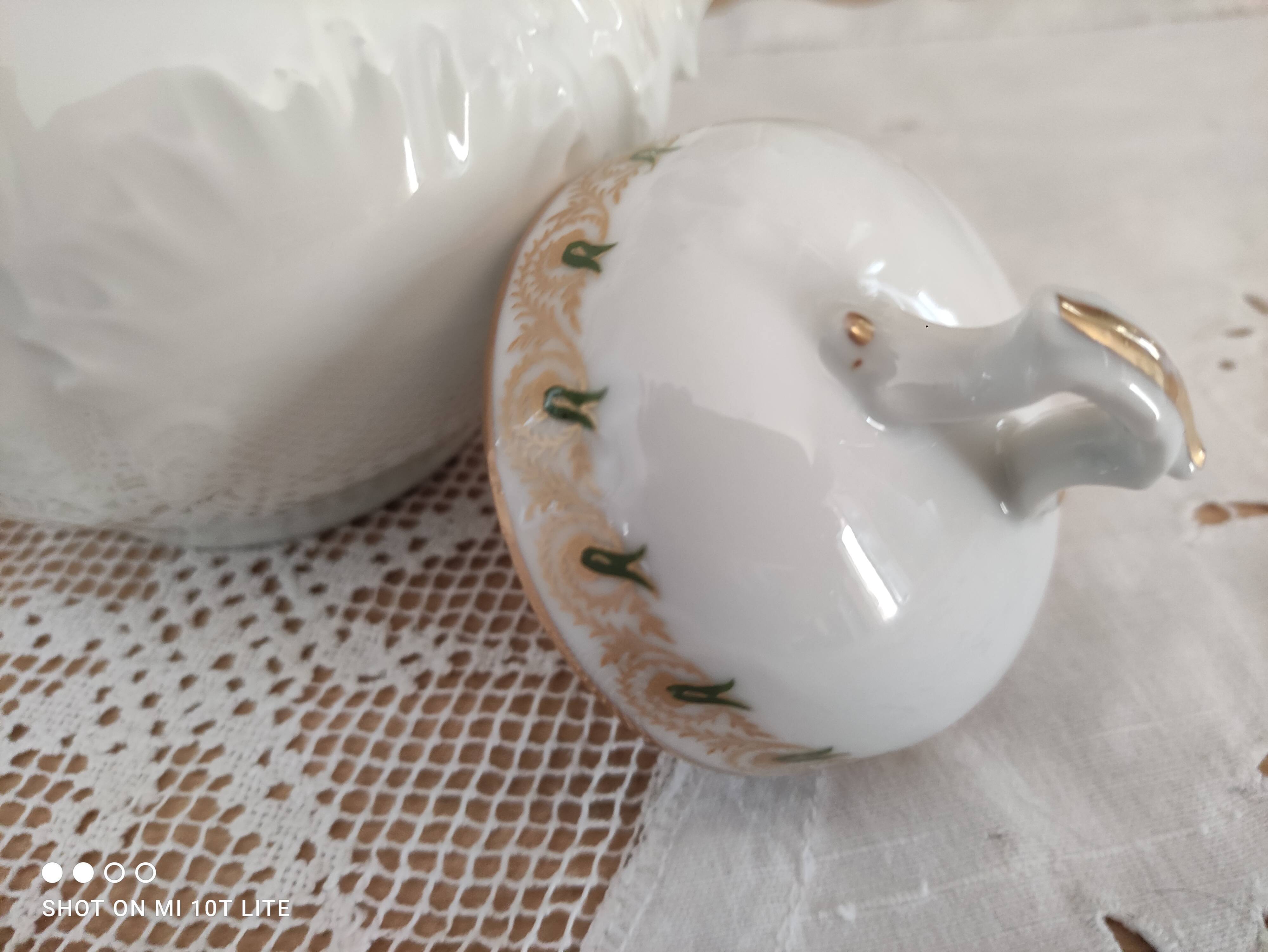 White porcelain sugar bowl decoration in relief and green and gold frieze