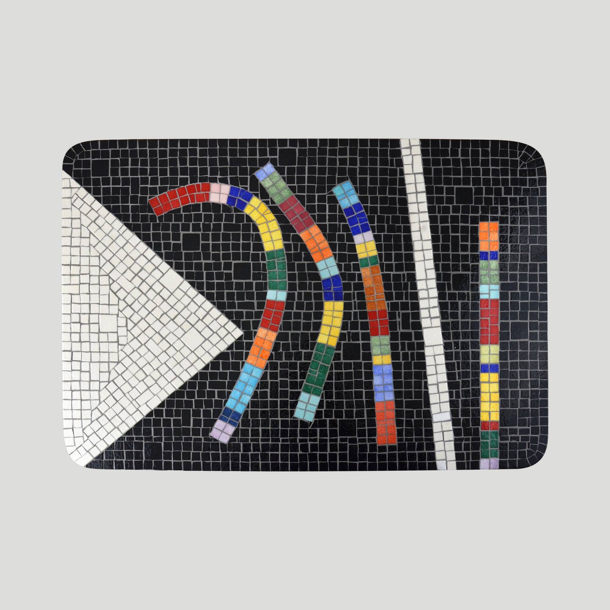 Table topped with a ceramic mosaic featuring an abstract design.