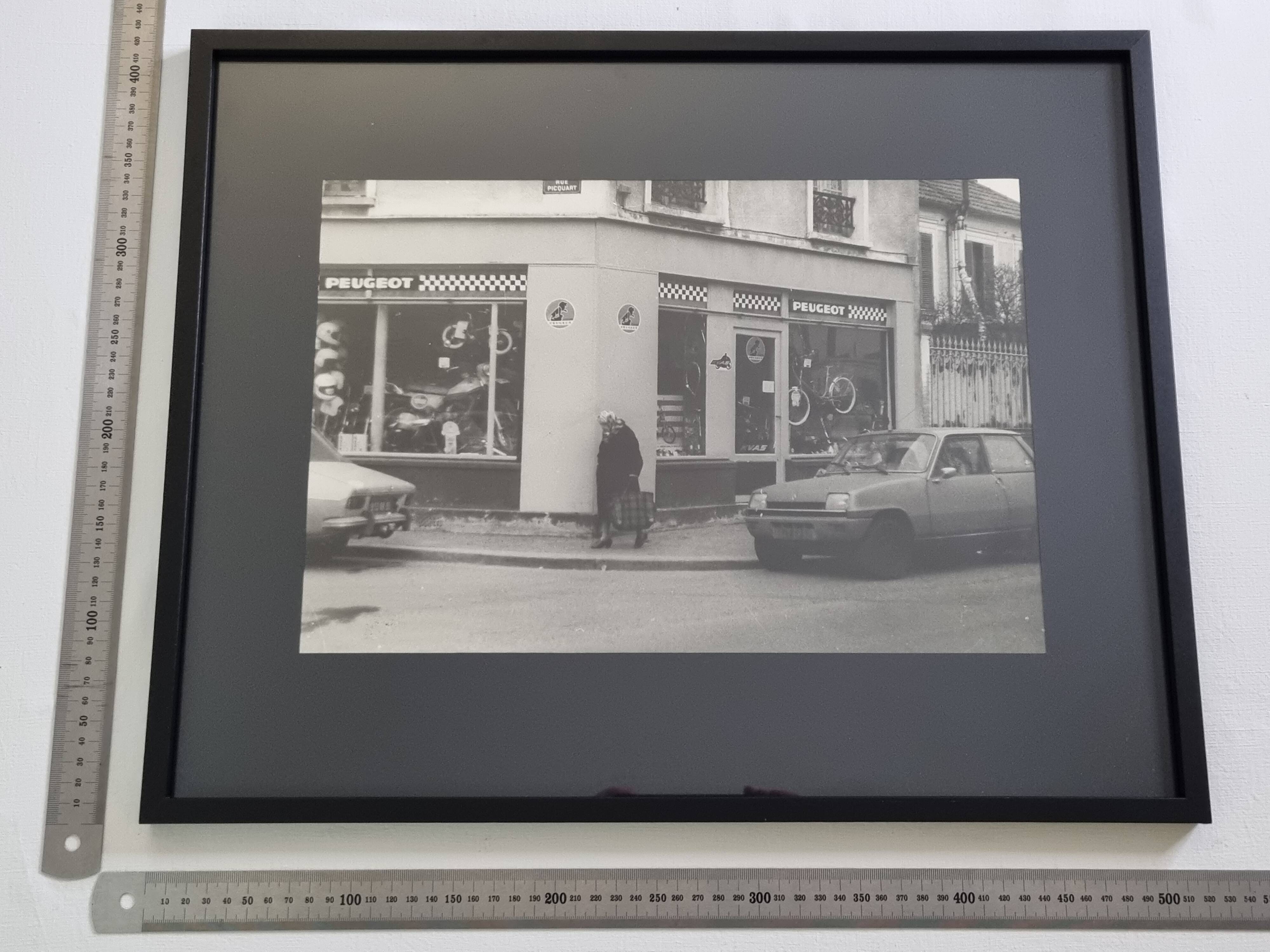 Vintage silver gelatin print of a street scene in a shop window, 1970s, framed, 52 x 42 cm