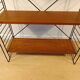 Mid century free standing rack with teak shelves by Dekker – Tomado