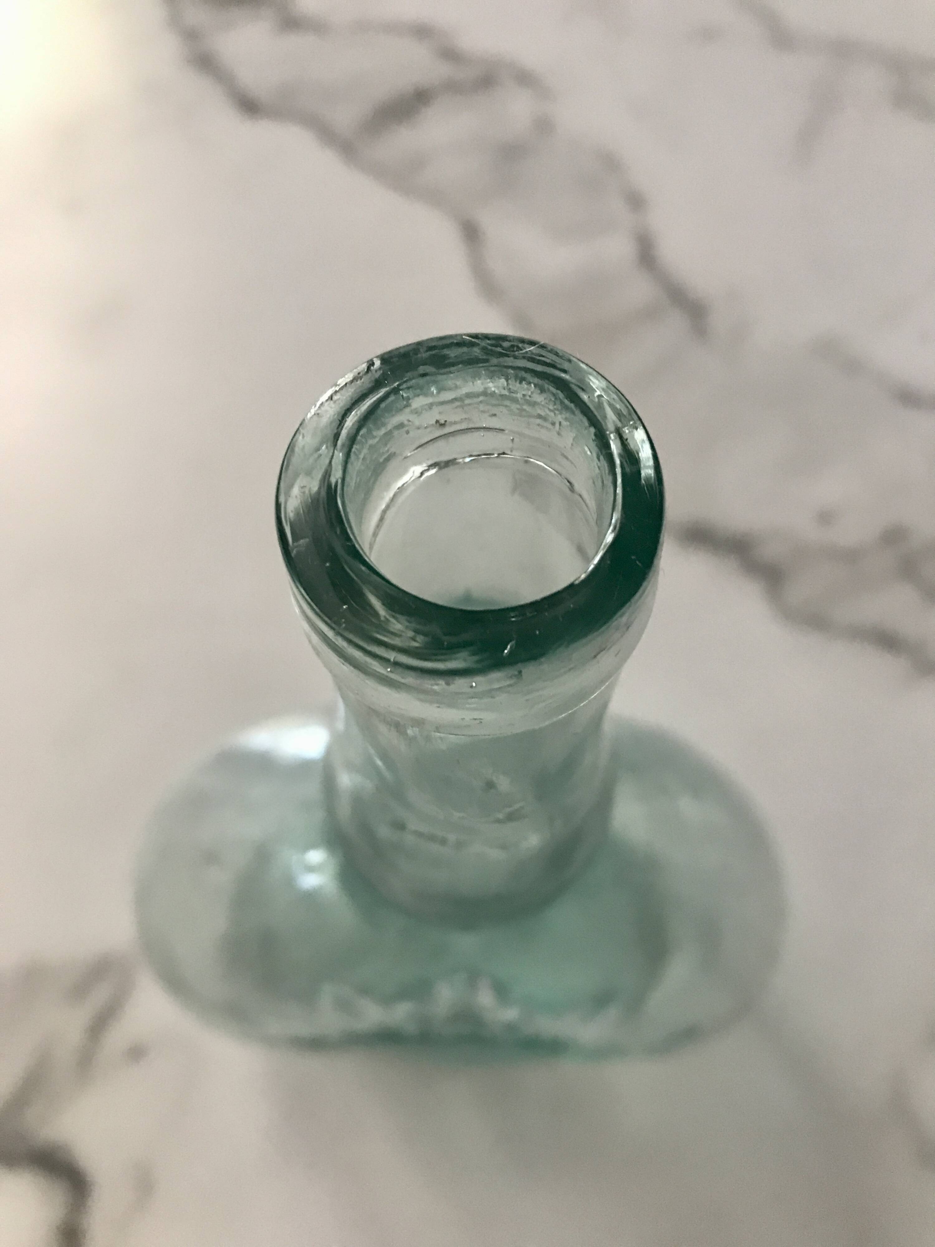 Bouteille vintage embossage soleil