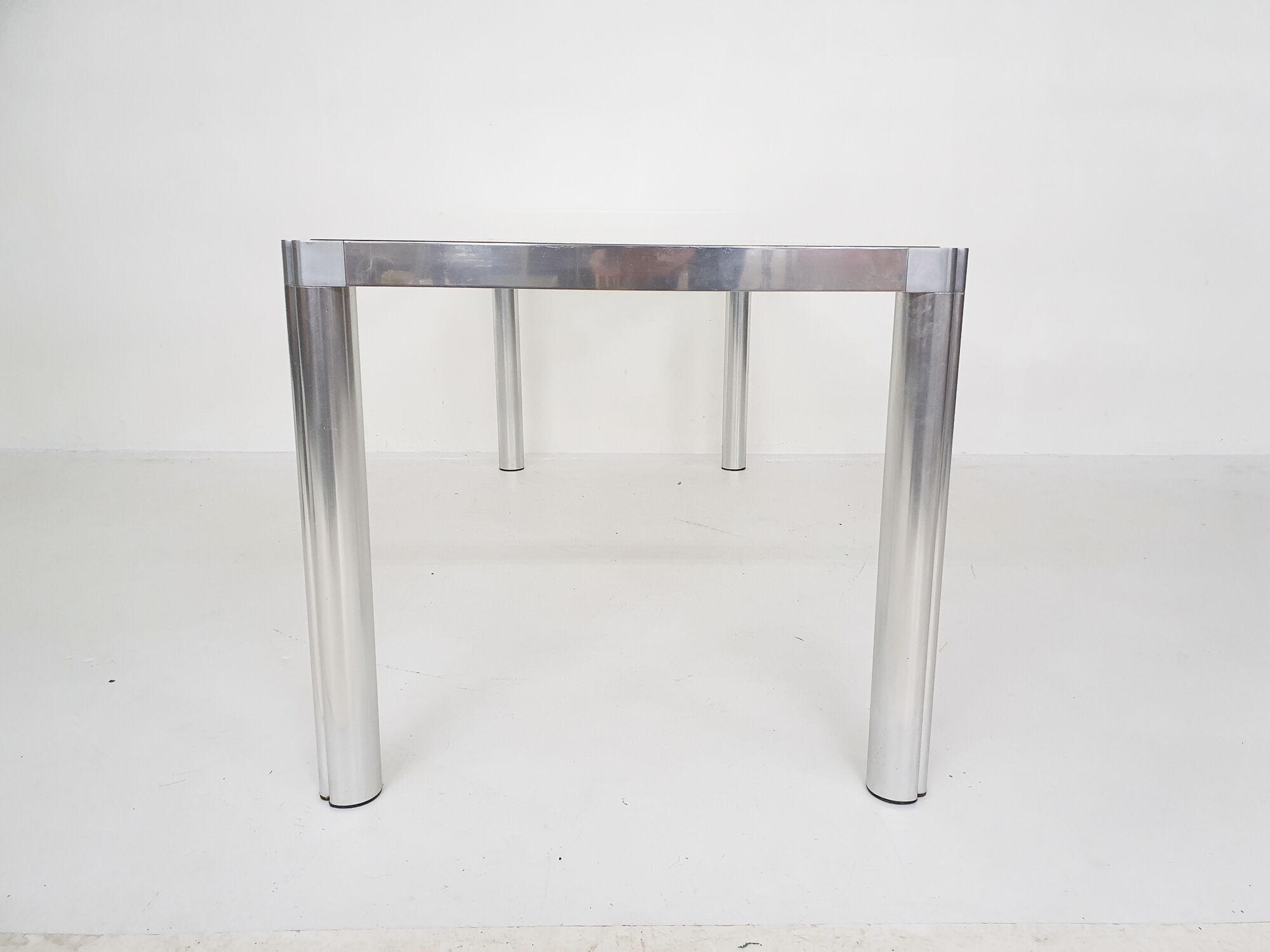 Glass and aluminum dining table by kho liang ie, the netherlands 1974
