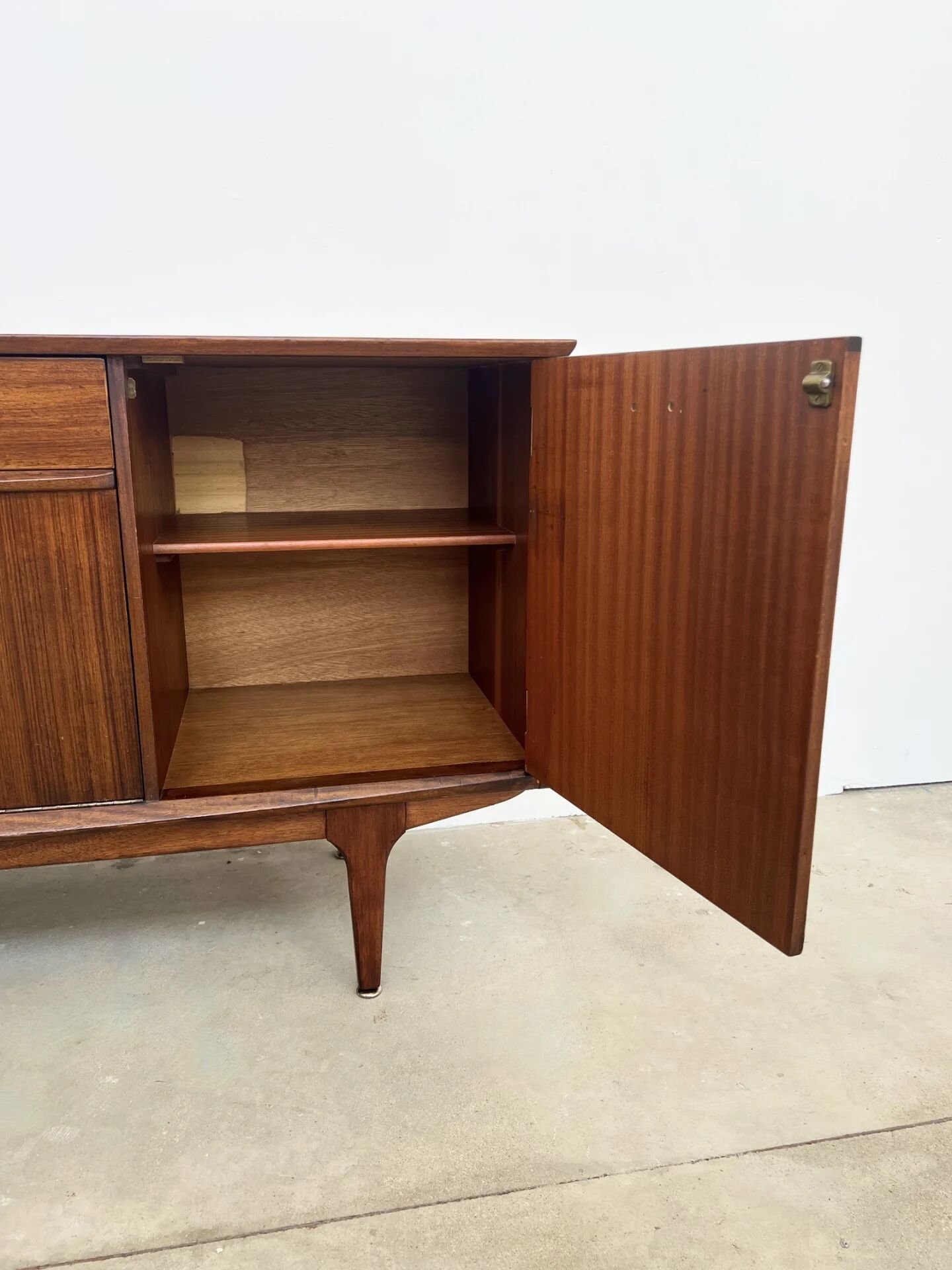 Teak Jentique sideboard — 1 door, 2 drawers & drop-down bar, England 1950s-60s