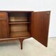 Teak Jentique sideboard — 1 door, 2 drawers & drop-down bar, England 1950s-60s