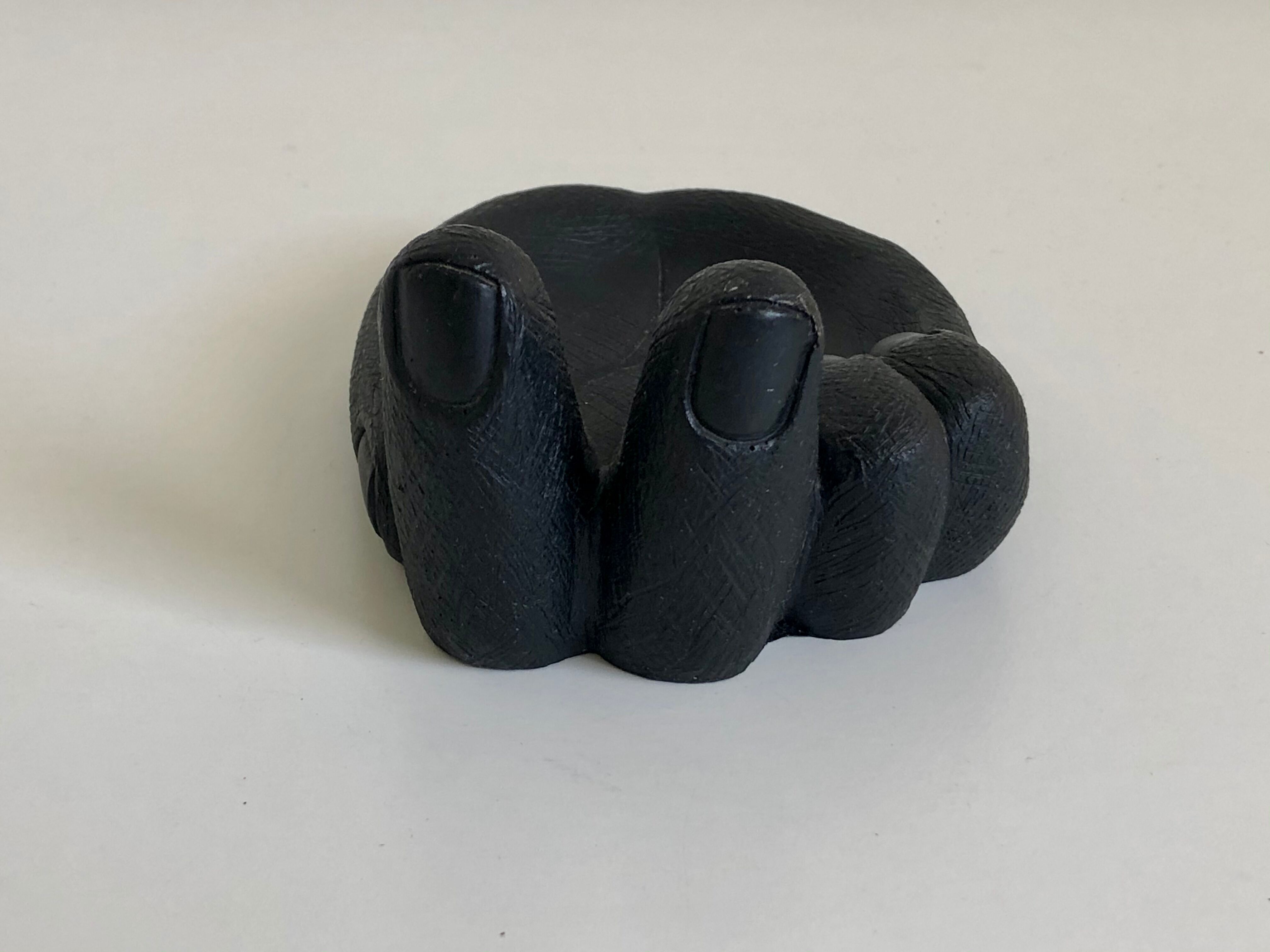 Empty pocket in Hawaiian lava in the shape of a hand signed Coco Joe, 1960