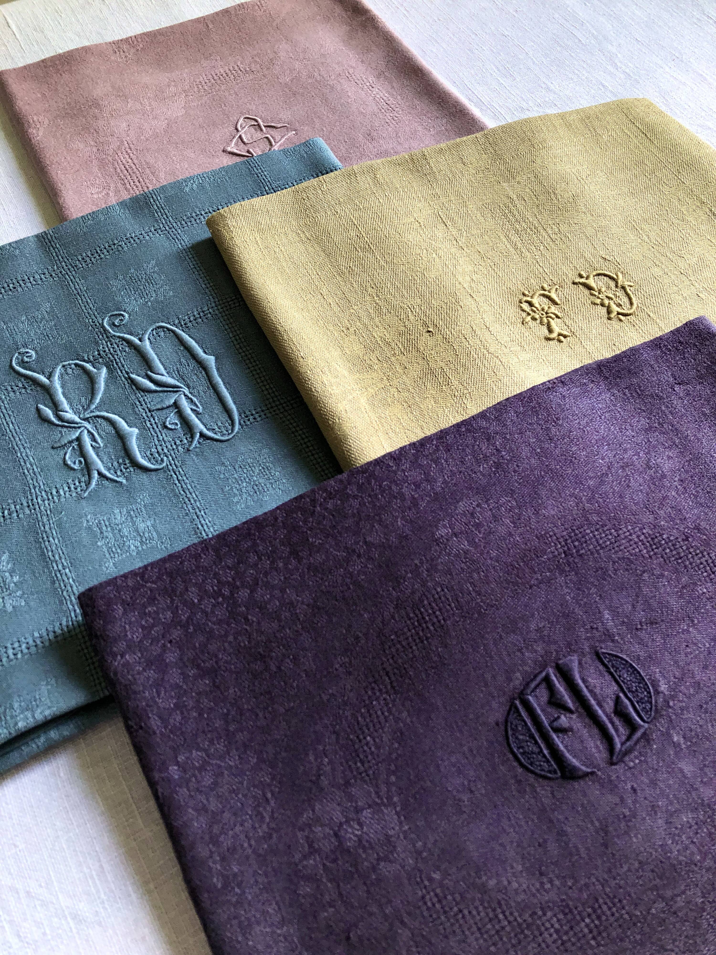 Suite of four tinted antique napkins