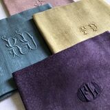 Suite of four tinted antique napkins