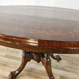 Coffee table in walnut with maple inlays and wheels