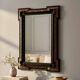 Antique wall mirror in blackened wood and gilded stucco, 19th-century Dutch style.