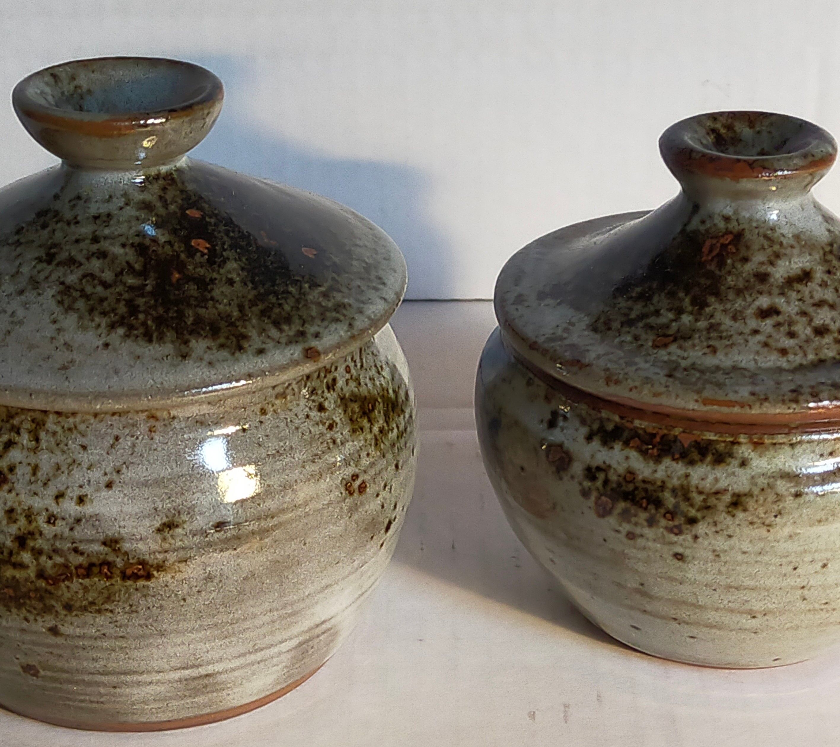 Duo of potter's pots covered in vintage glazed stoneware