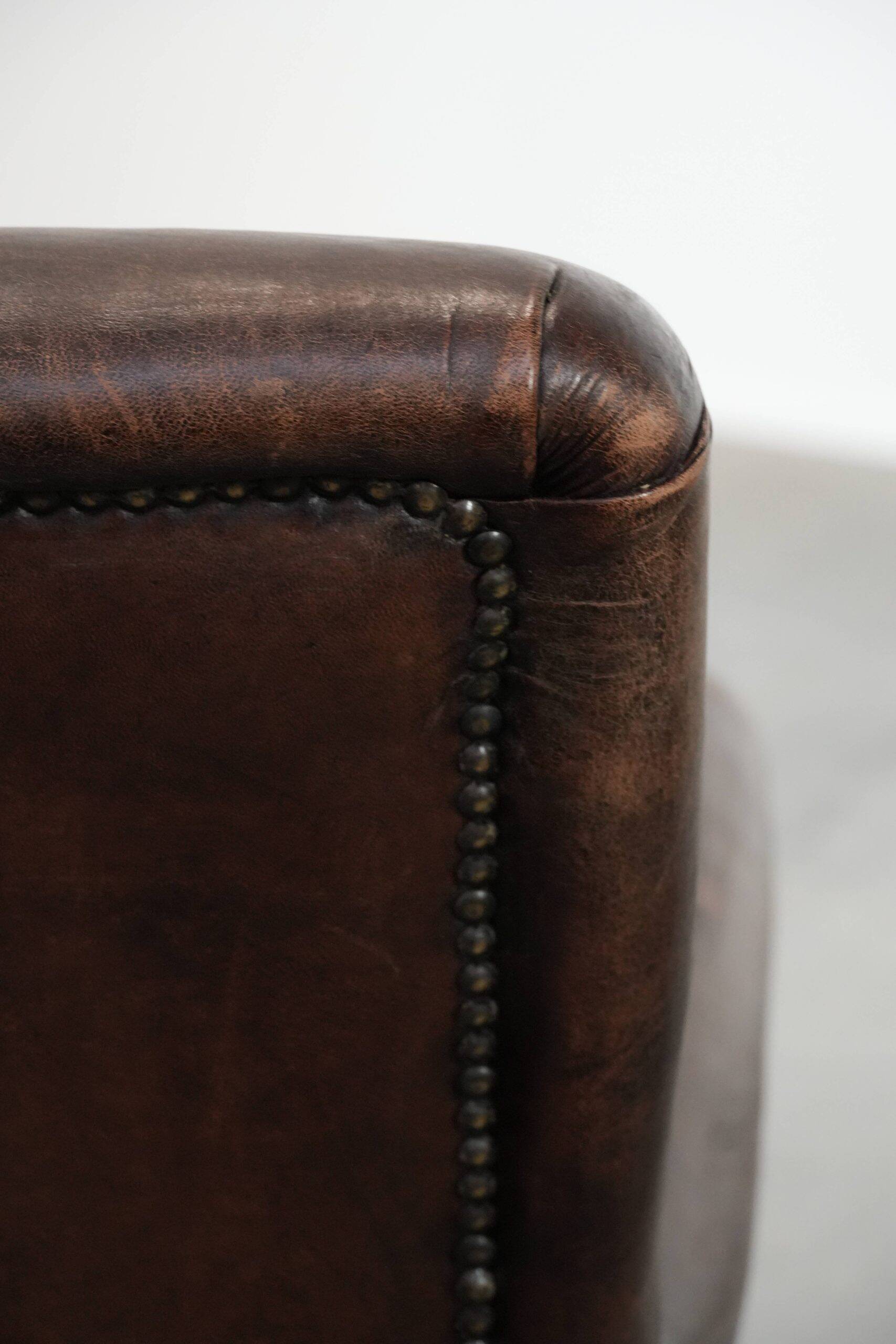 Set of two characterful sheepskin armchairs with a beautiful deep colour