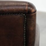 Set of two characterful sheepskin armchairs with a beautiful deep colour