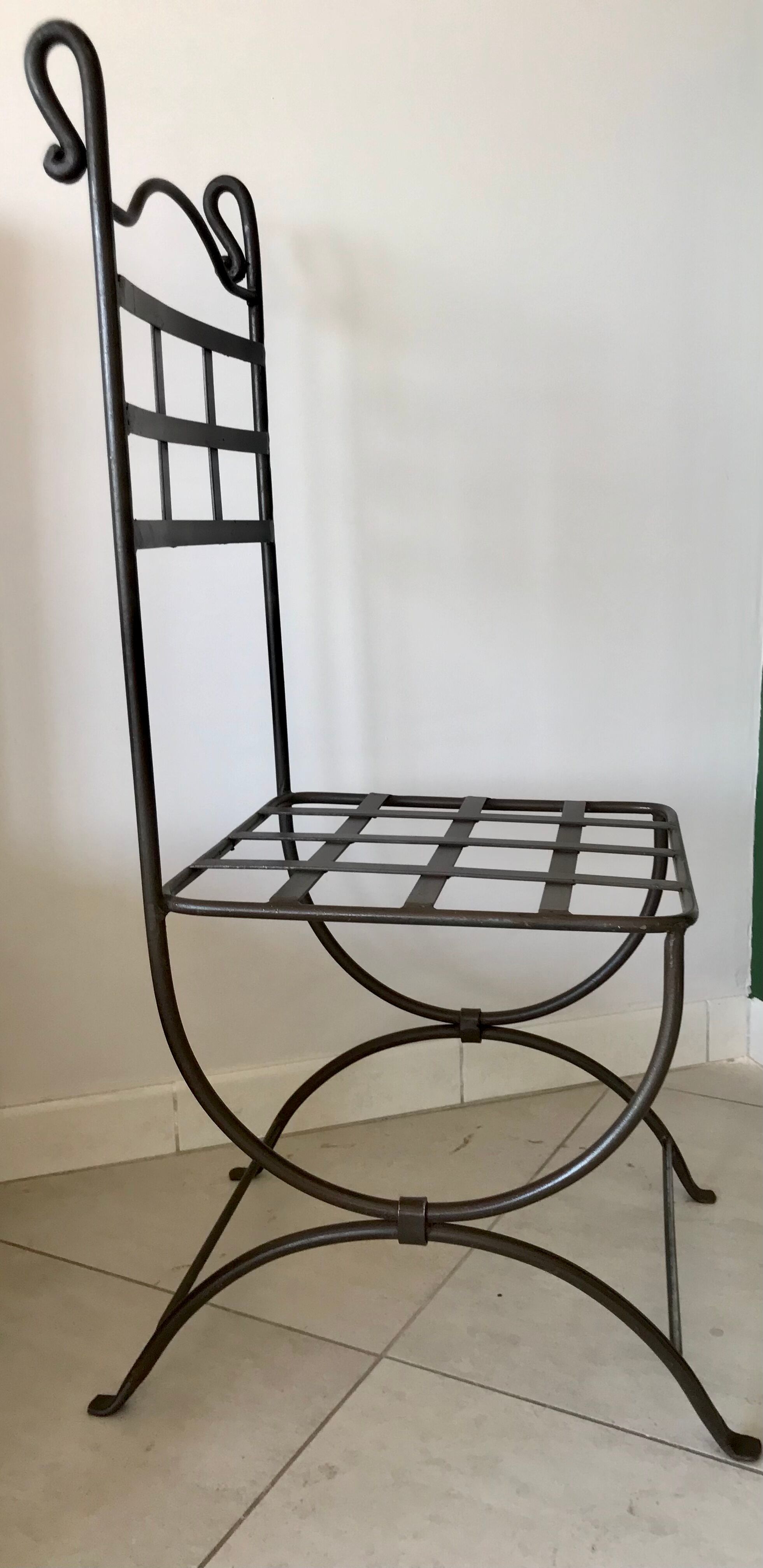 Six wrought iron chairs
