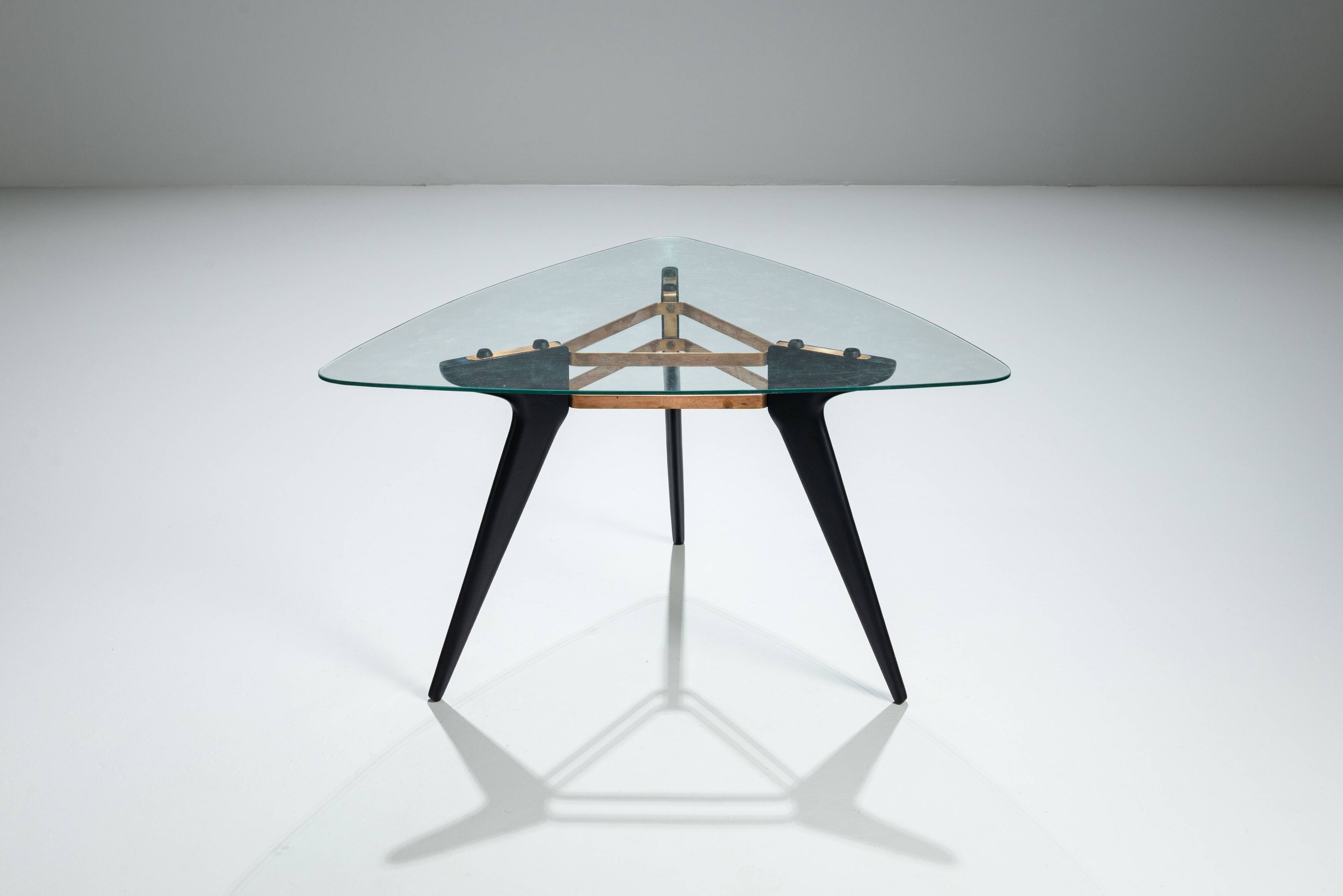 Triangular coffee table in the manner of Alfred Hendrickx