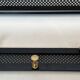 Coat rack in black lacquered metal, perforated sheet metal and brass in the style of Mathieu Matégot