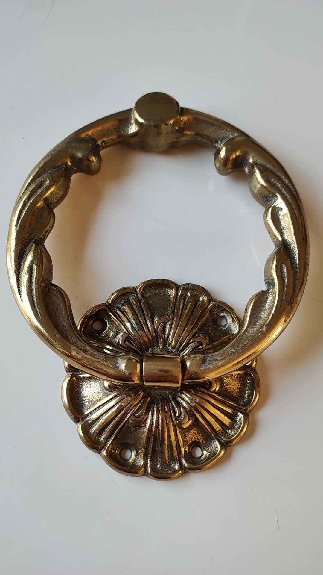 Antique door knocker/hammer of floral shape with large ring decorated with scrolls of acanthus