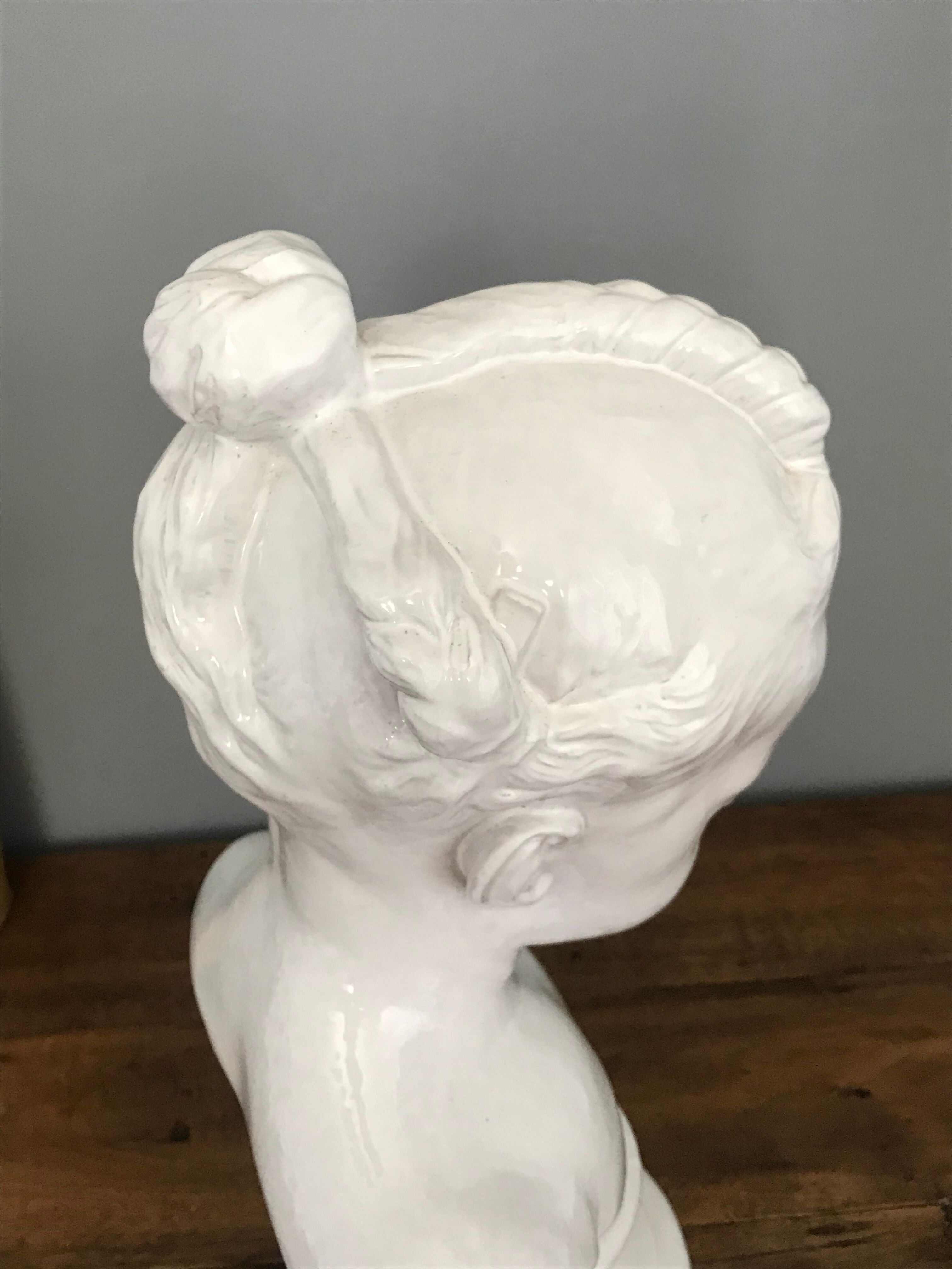 Child bust in enamelled terracotta