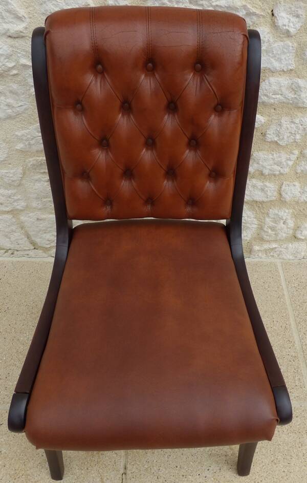Chic Vintage Chesterfield style chair with wooden frame and faux leather