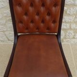 Chic Vintage Chesterfield style chair with wooden frame and faux leather