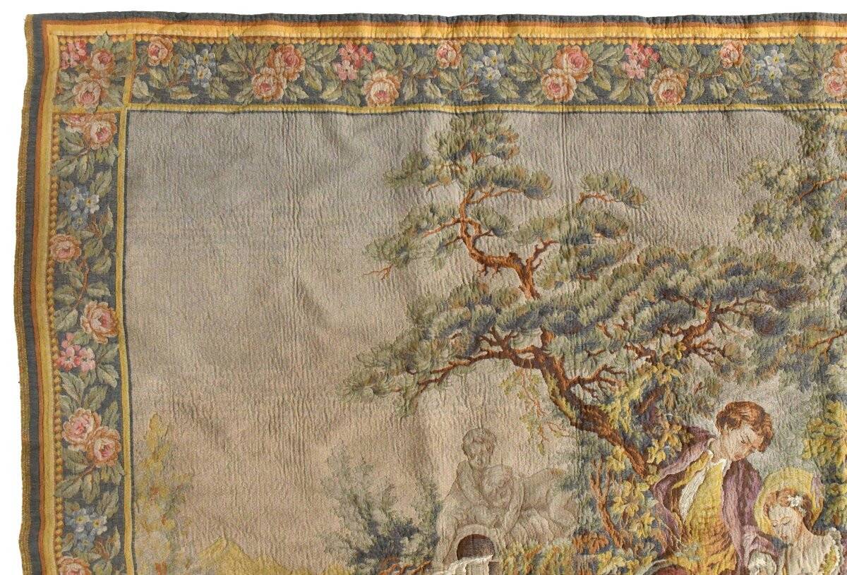 Wall tapestry featuring a pastoral scene.