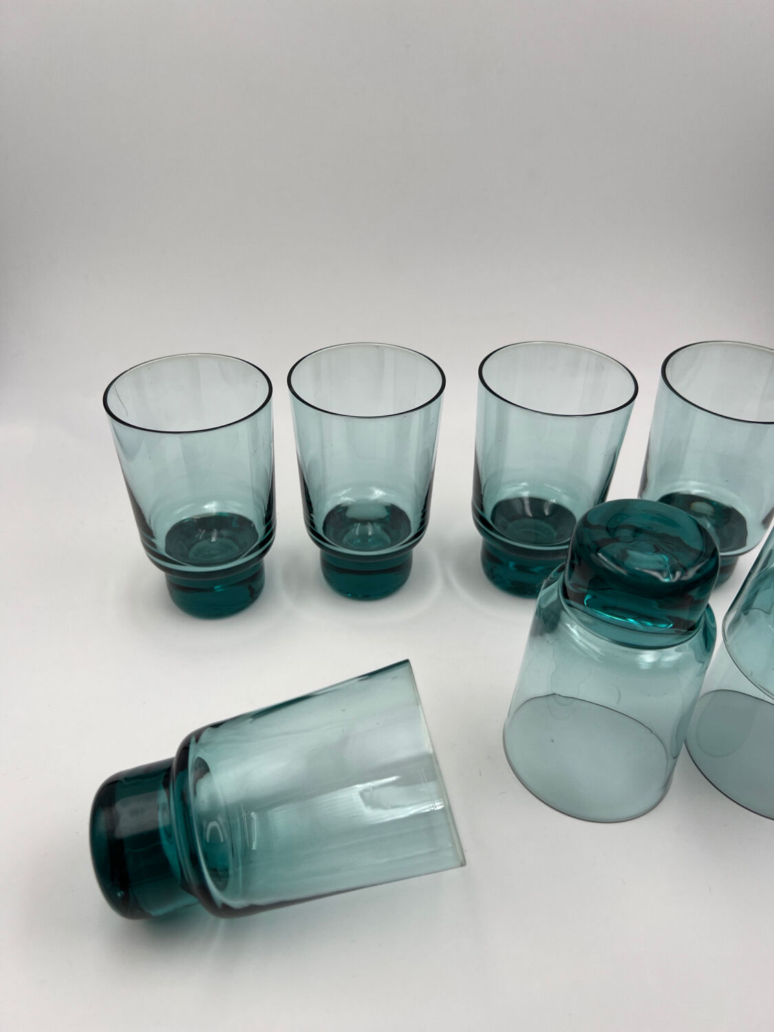 Eight bluish glass water glasses
