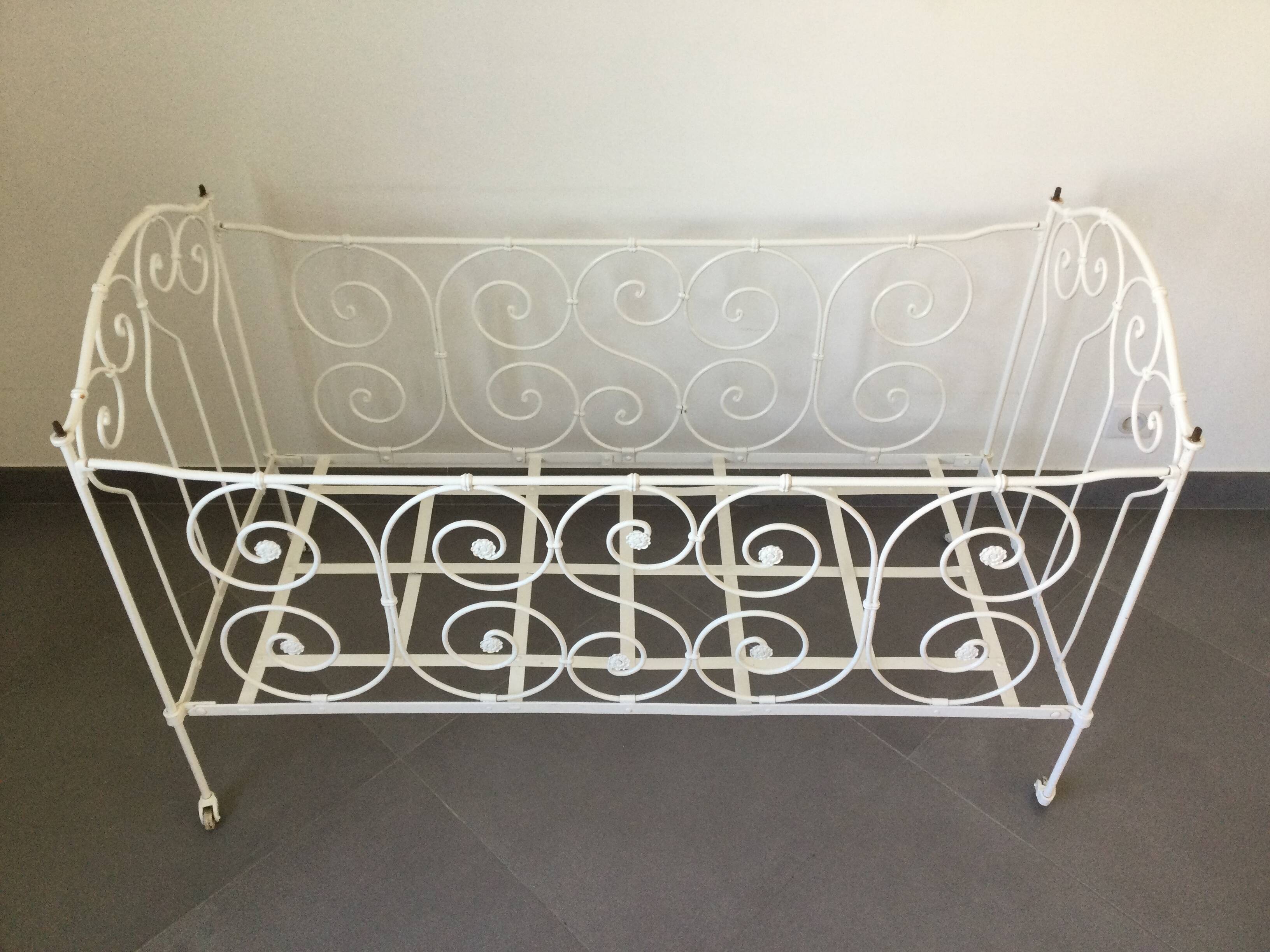 White wrought iron folding bed