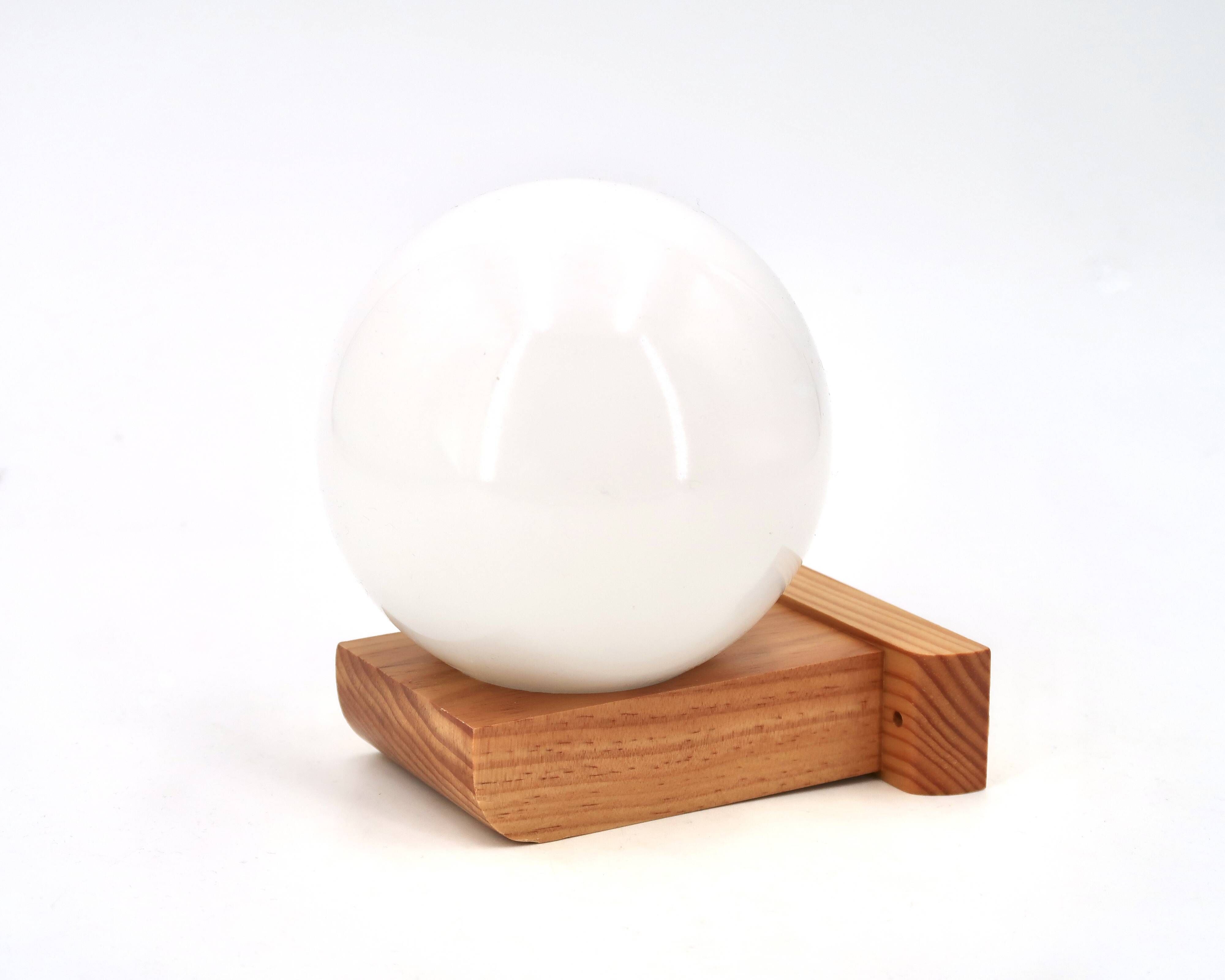 Wall light in pine wood with opaque white glass globe, 1980s