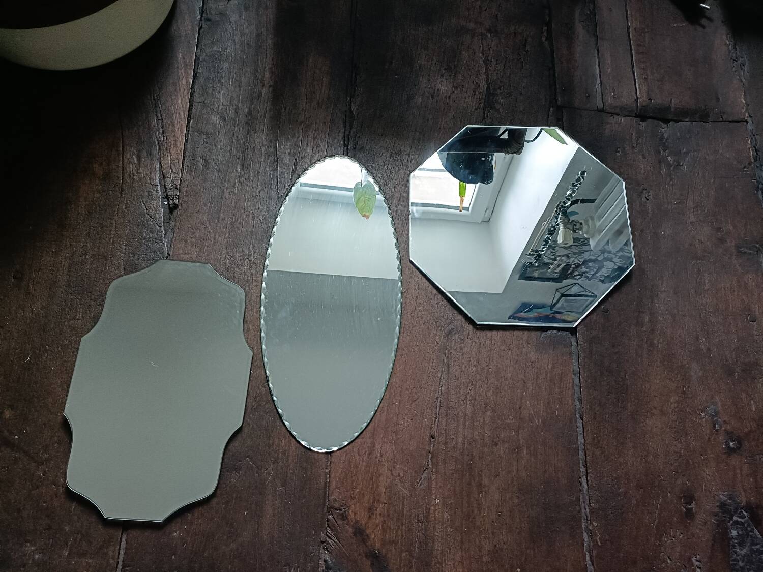 Three beveled mirrors