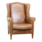 Fauteuil à oreilles en cuir de vachette cognac clair