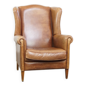 Fauteuil à oreilles en cuir de vachette cognac clair
