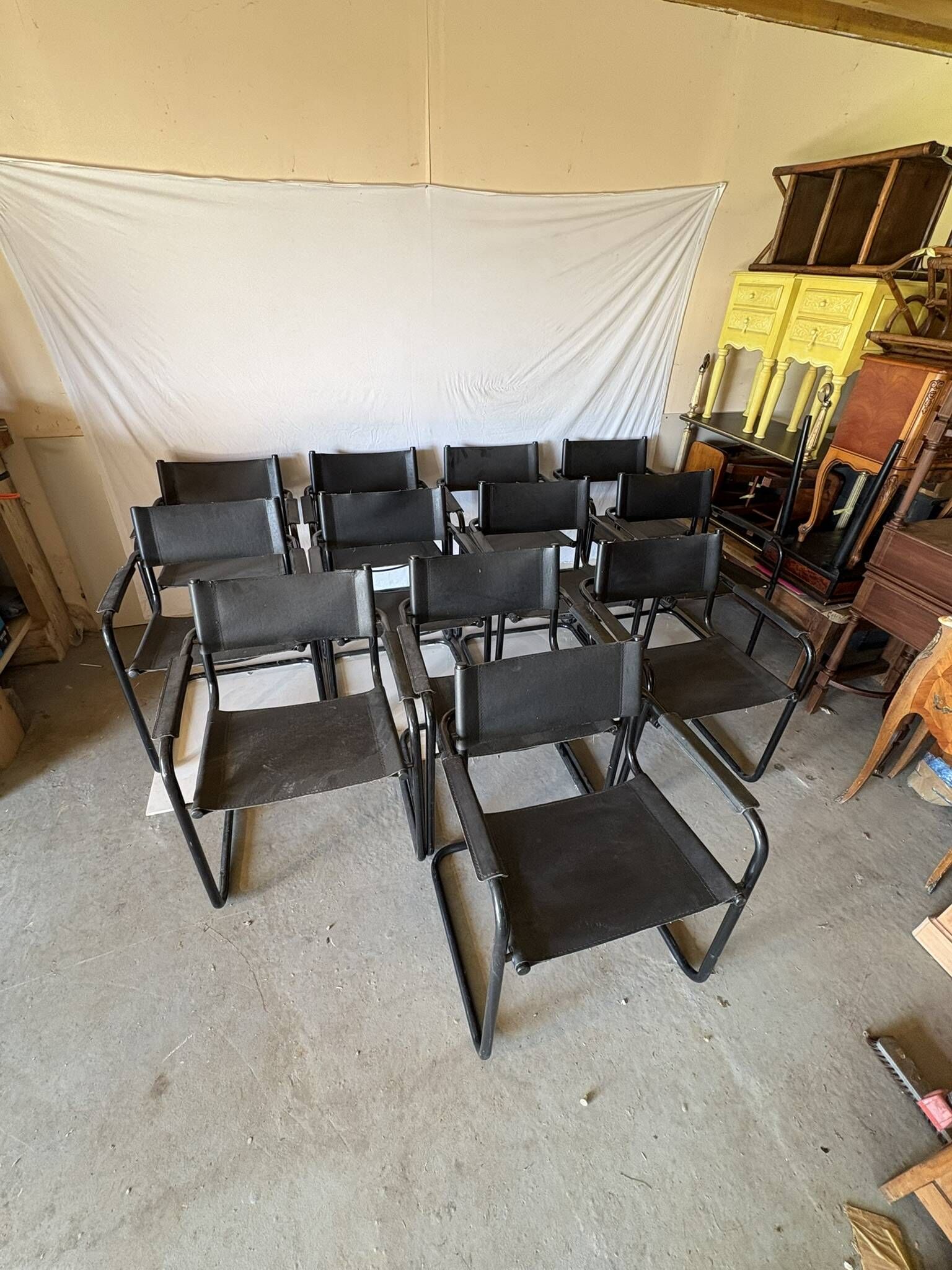 Set of 12 vintage black leather and tubular steel chairs – Italy, year