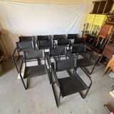 Set of 12 vintage chairs in black leather and tubular steel – Italy, 1970s