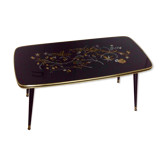 Table basse, année 60, noir à motifs fleuris