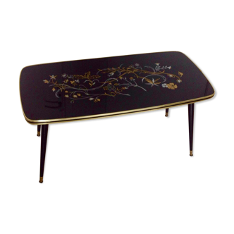 Table basse, année 60, noir à motifs fleuris