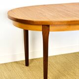 Oval teak dining table with extension