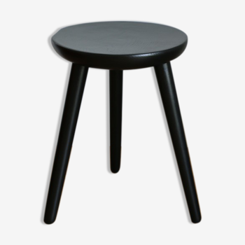 Black tripod wooden stool
