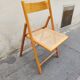 Wooden folding chair with caning from the 1980s.