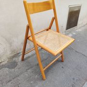 Wooden folding chair with cane from the 1980s.