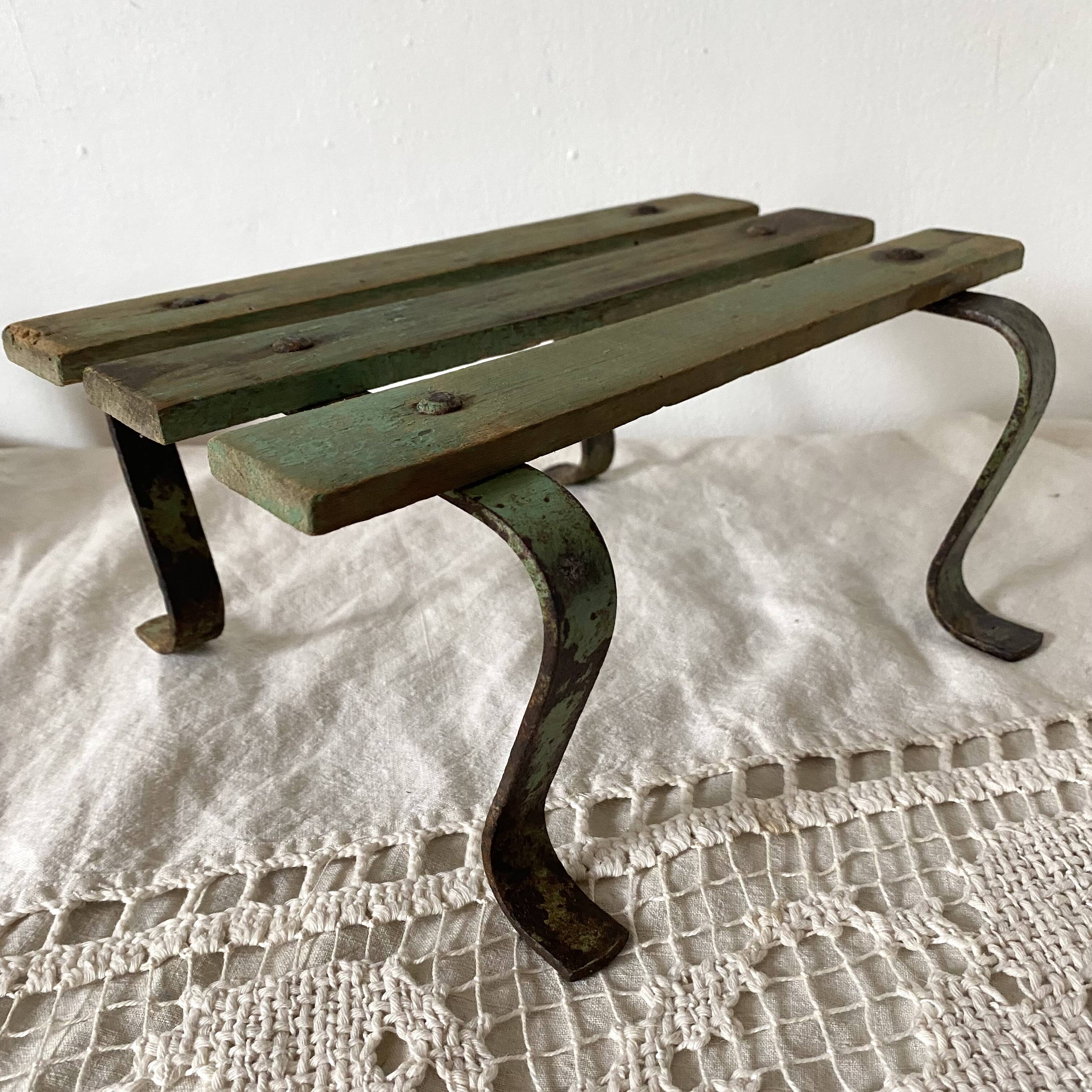 Low stool with wooden and metal slats