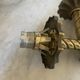 Pair of neoclassical wall sconces in twisted brass and ribbed glass.