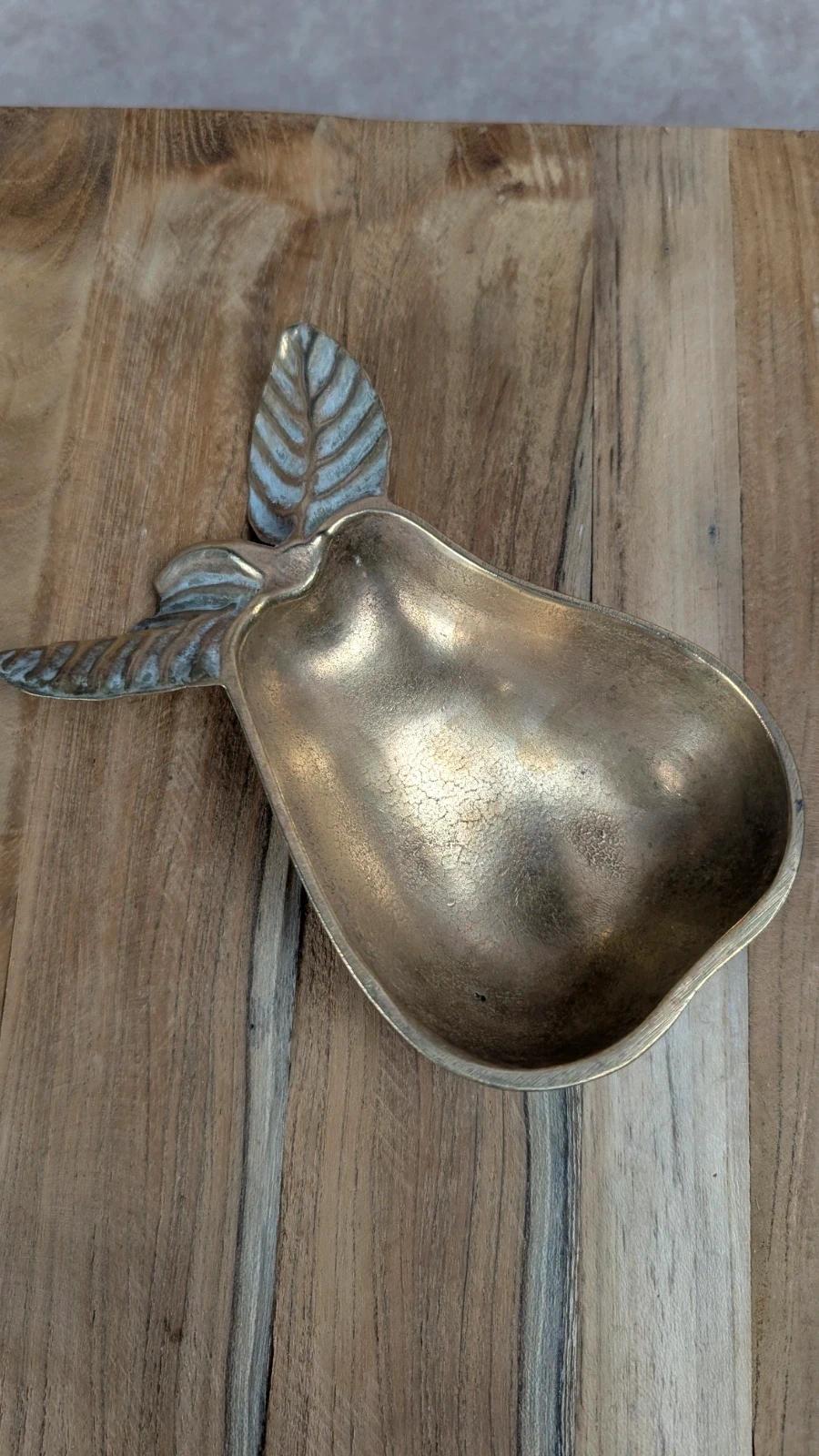 Small vintage brass trinket dish in the shape of a pear.